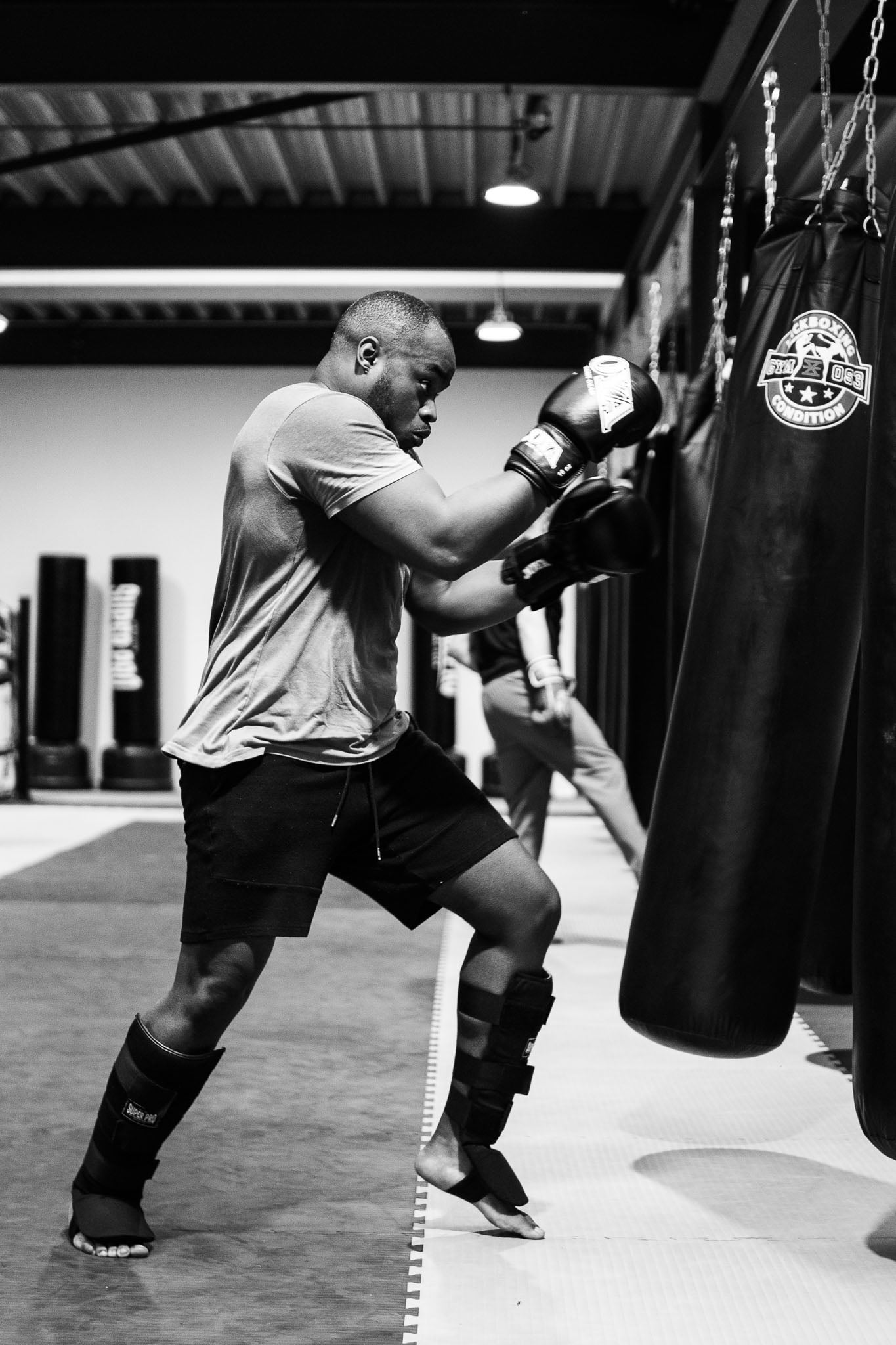 A member working the heavy bag at GYM053